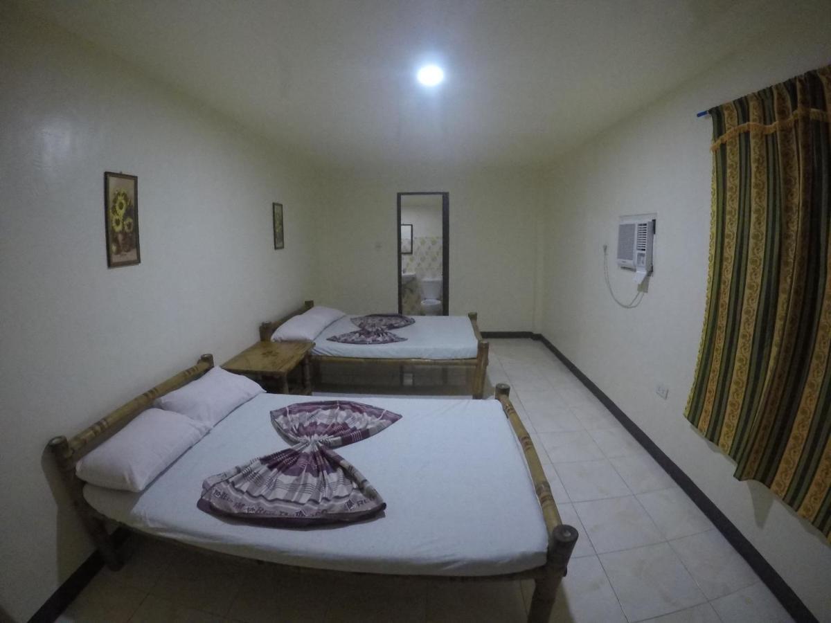 Se San Beach Resort-Isla De Gigantes Carles Bagian luar foto